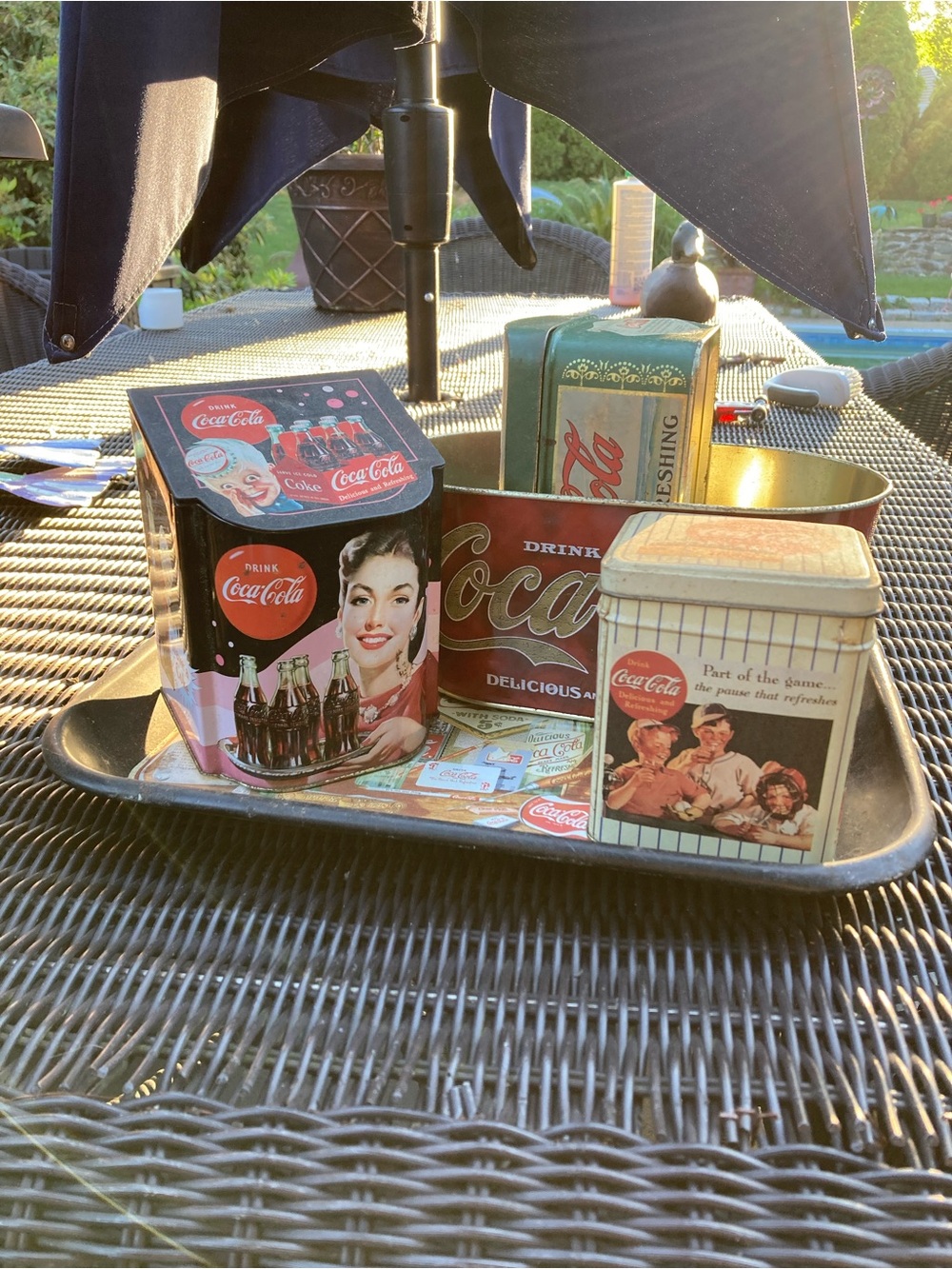 Assorted Coca Cola tin items